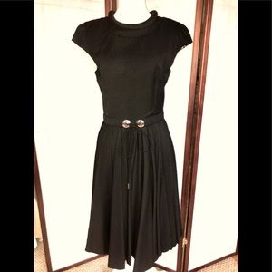 Dolce and Gabbanna black cocktail dress with flared bottom.